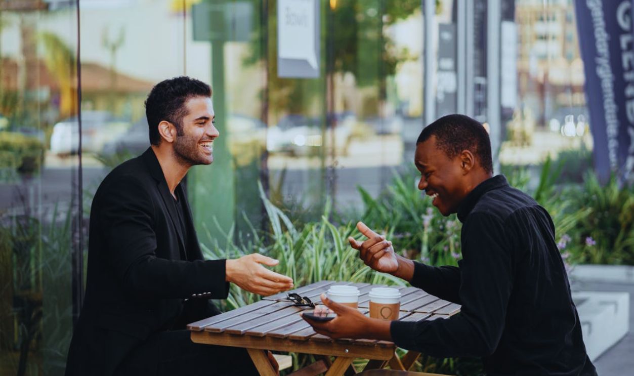 Happy Male Colleagues talking to each other