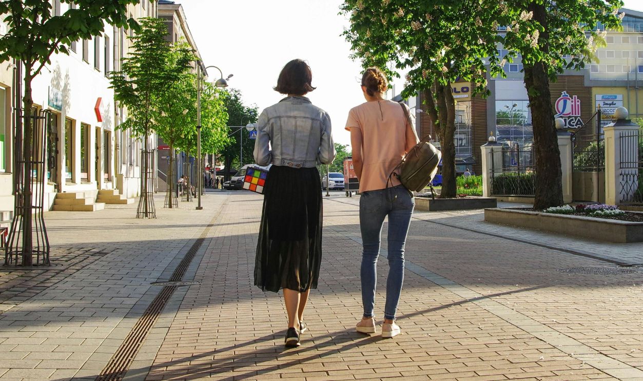 Photo of Women Walking Down the Street