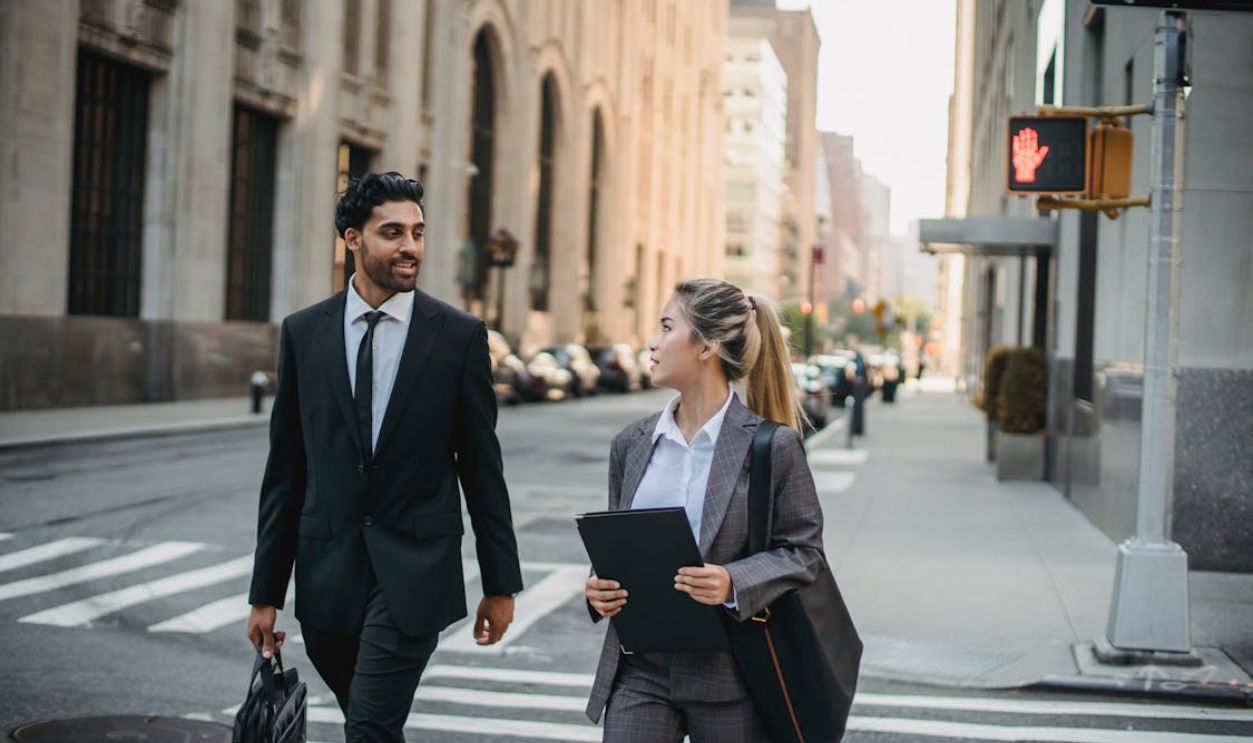 Man and Woman Walking on the Street