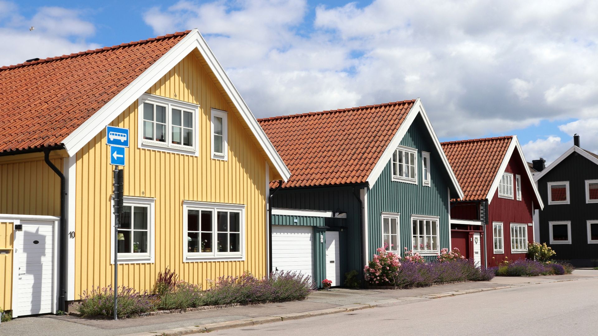 A row of colorful houses sitting next to each other