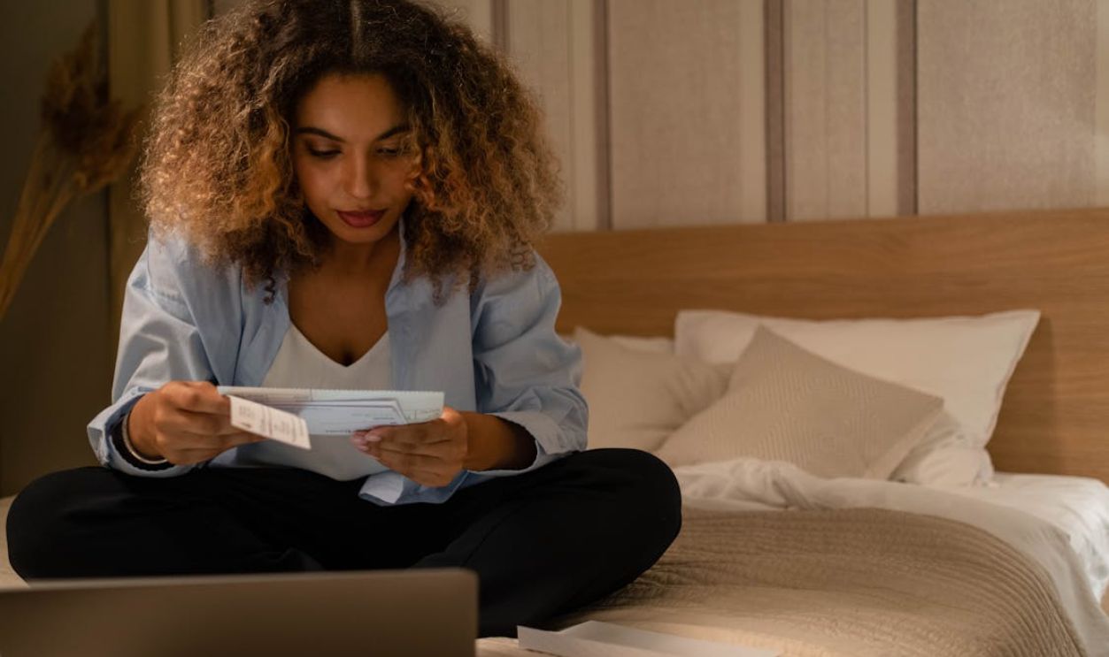 Photo of a Woman Reading a Letter