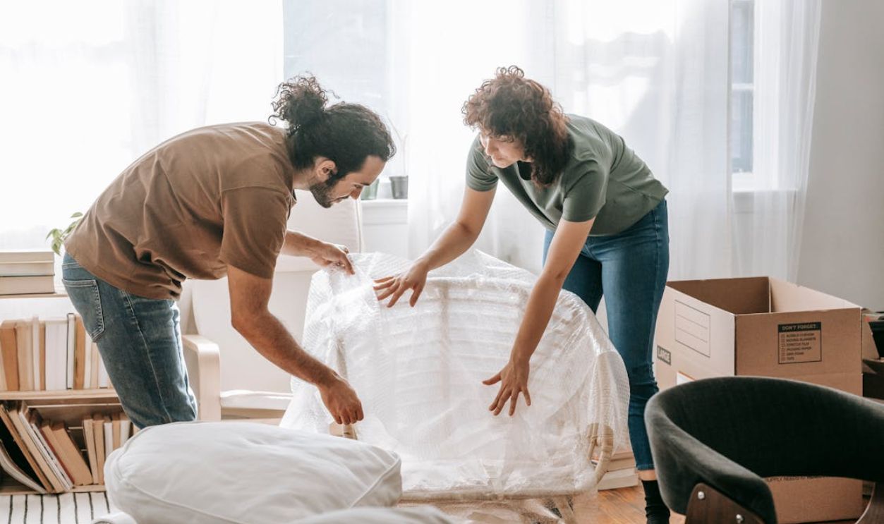 Couple Packing Up A Chair