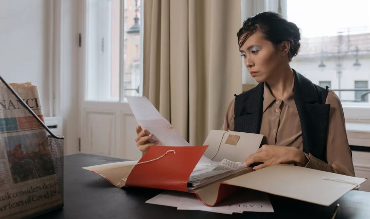 A Woman Holding Documents