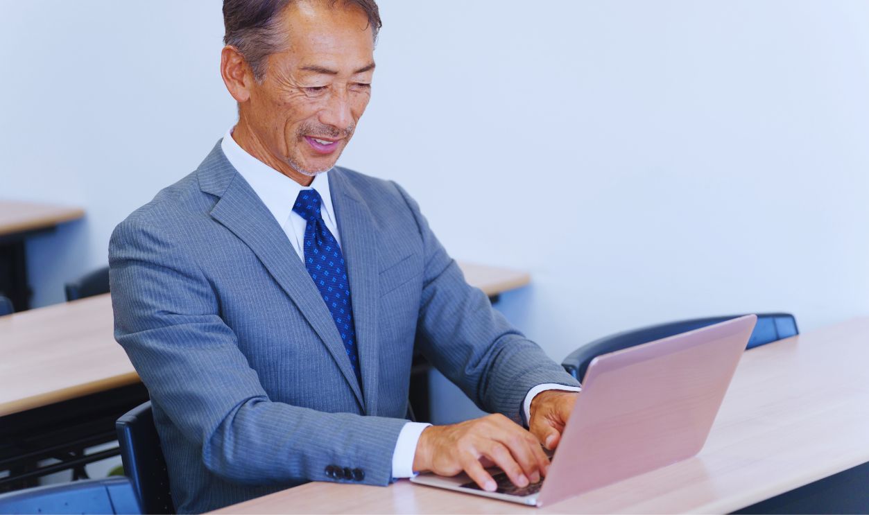 Senior businessman using a computer