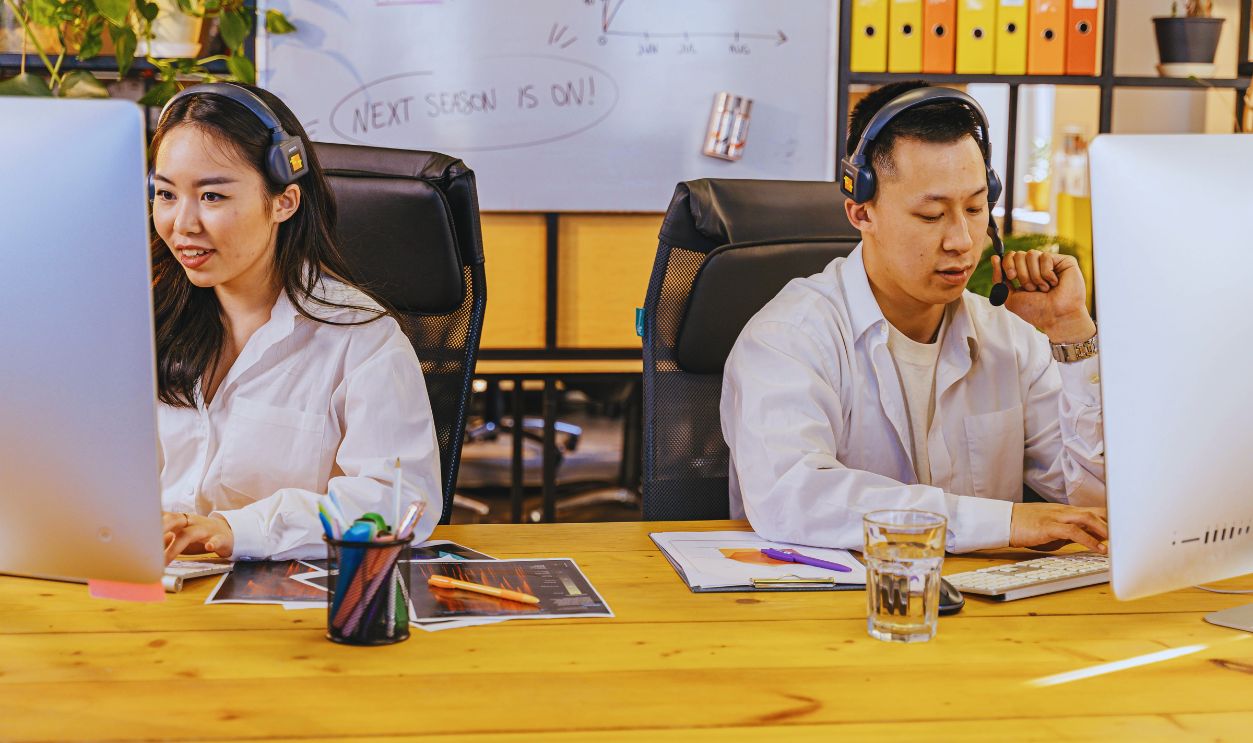 Man and Woman Working at Call Center