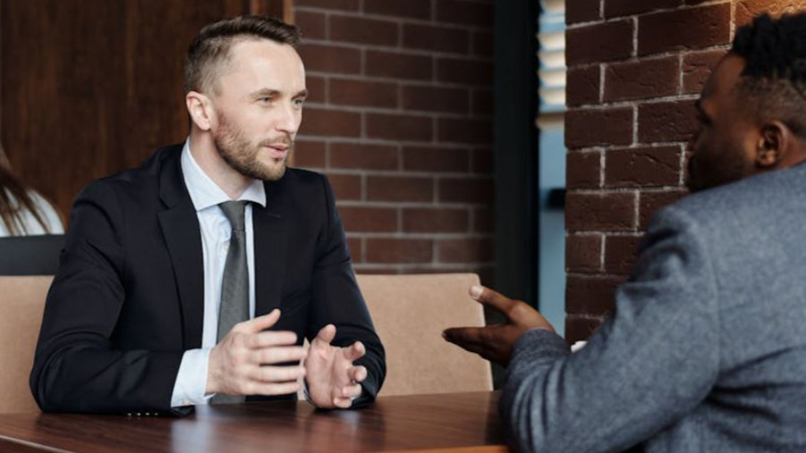 Businessmen Talking at a Cafe