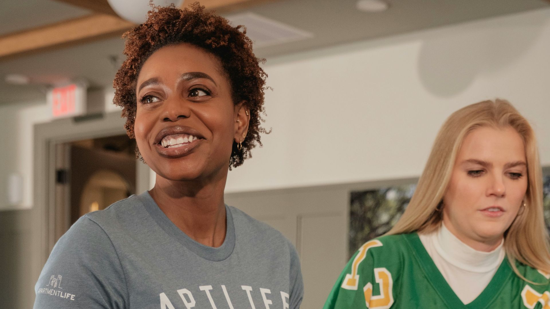 Two women at a gathering with snacks