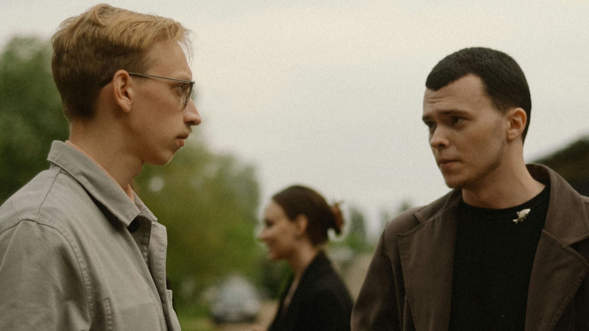 a couple of men standing next to each other