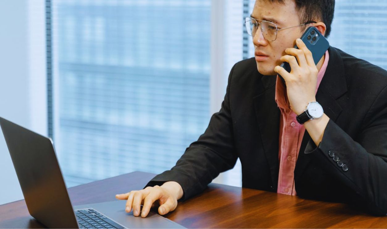 Man Talking on the Phone Busy Working