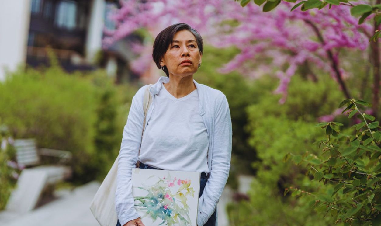 Woman Holding an Abstract Painting Painted in a Sketchpad