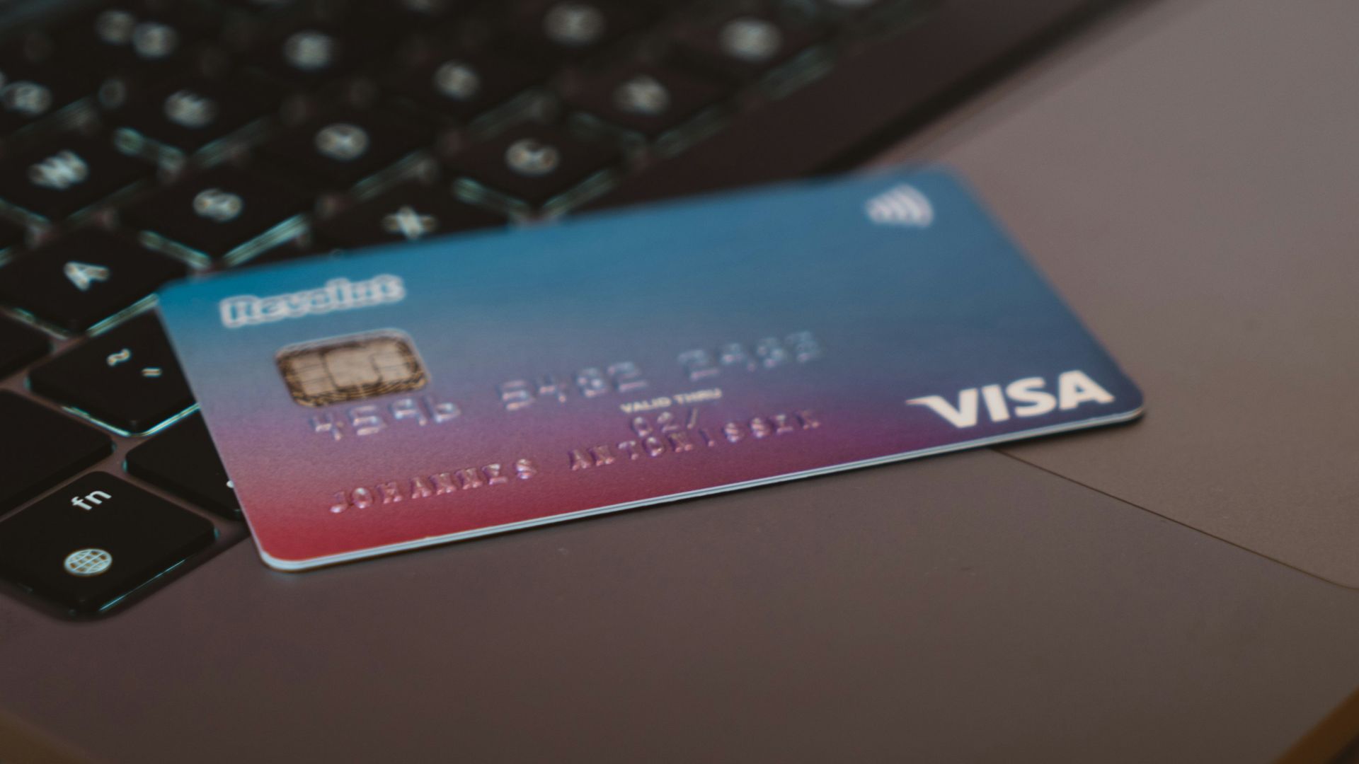 blue and white visa card on silver laptop computer