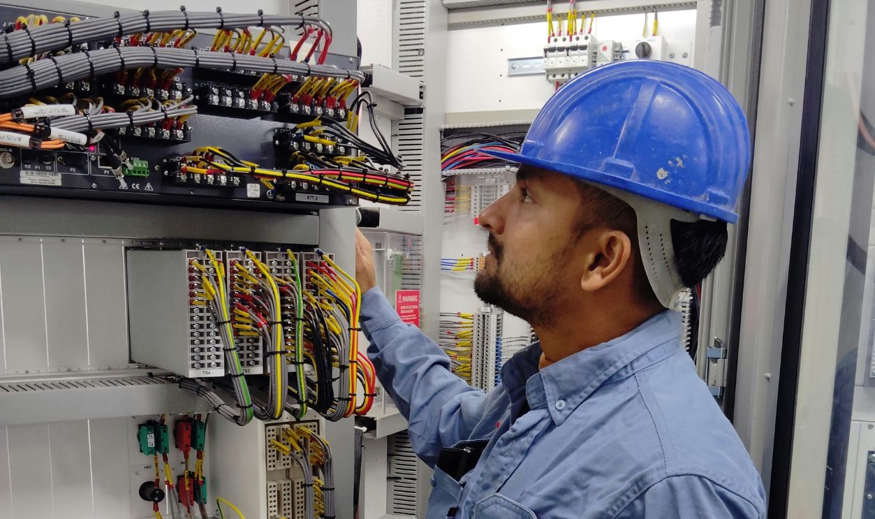 Electrician Working with Cables
