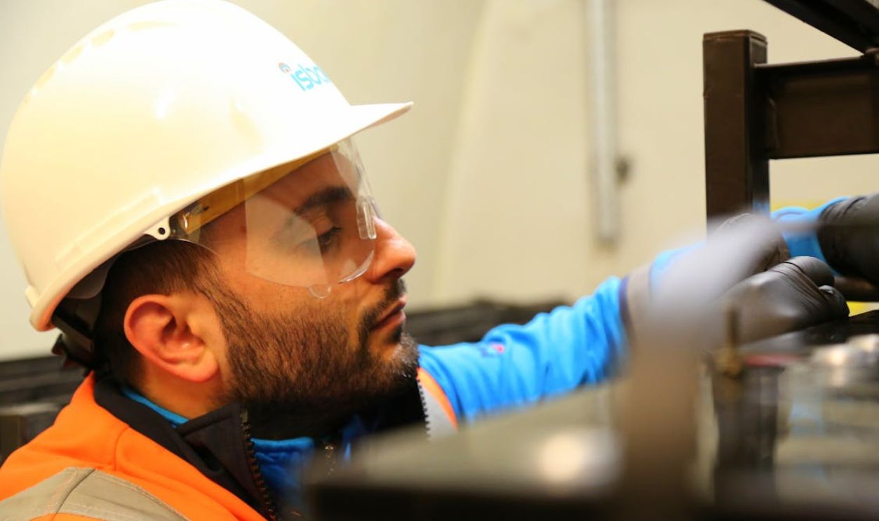 Man Wearing Helmet in a Factory