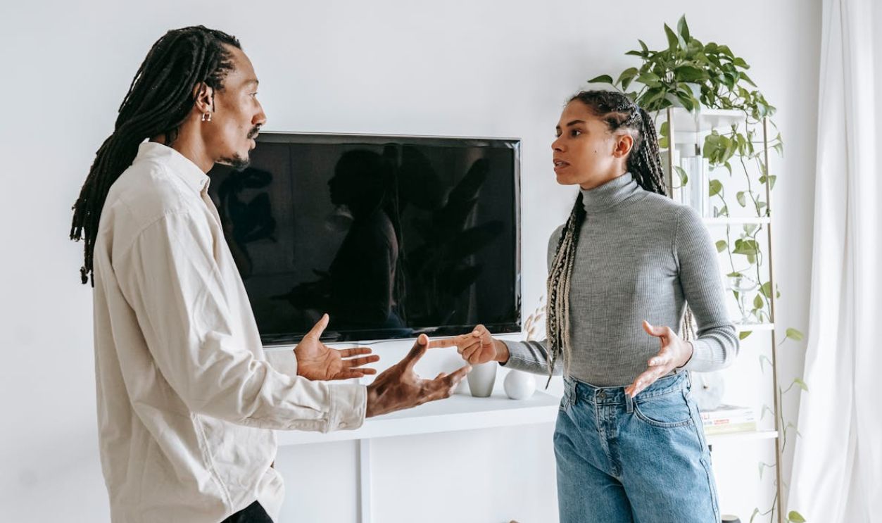 Dissatisfied young ethnic couple having argument at home