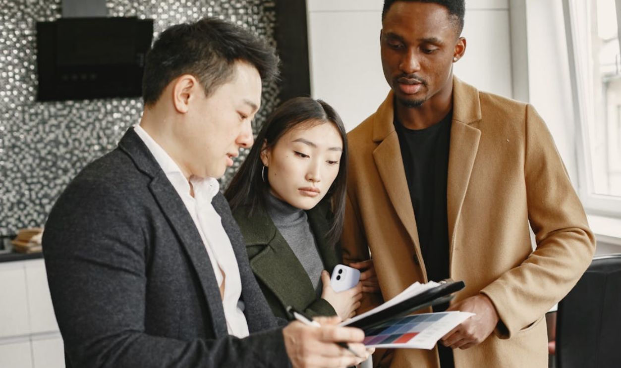 a Man in Brown Suit Looking at the Document