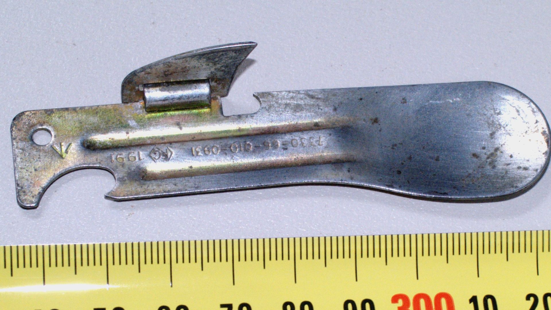 A can opener that incorporates a small spoon at one end and a can opener at the other is currently employed by the Australian Army and New Zealand Army in its ration kits.