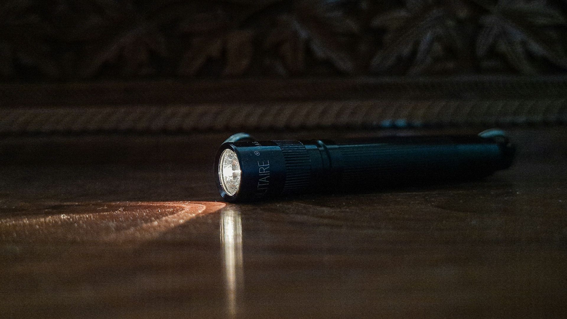 a flashlight sitting on the floor of a room