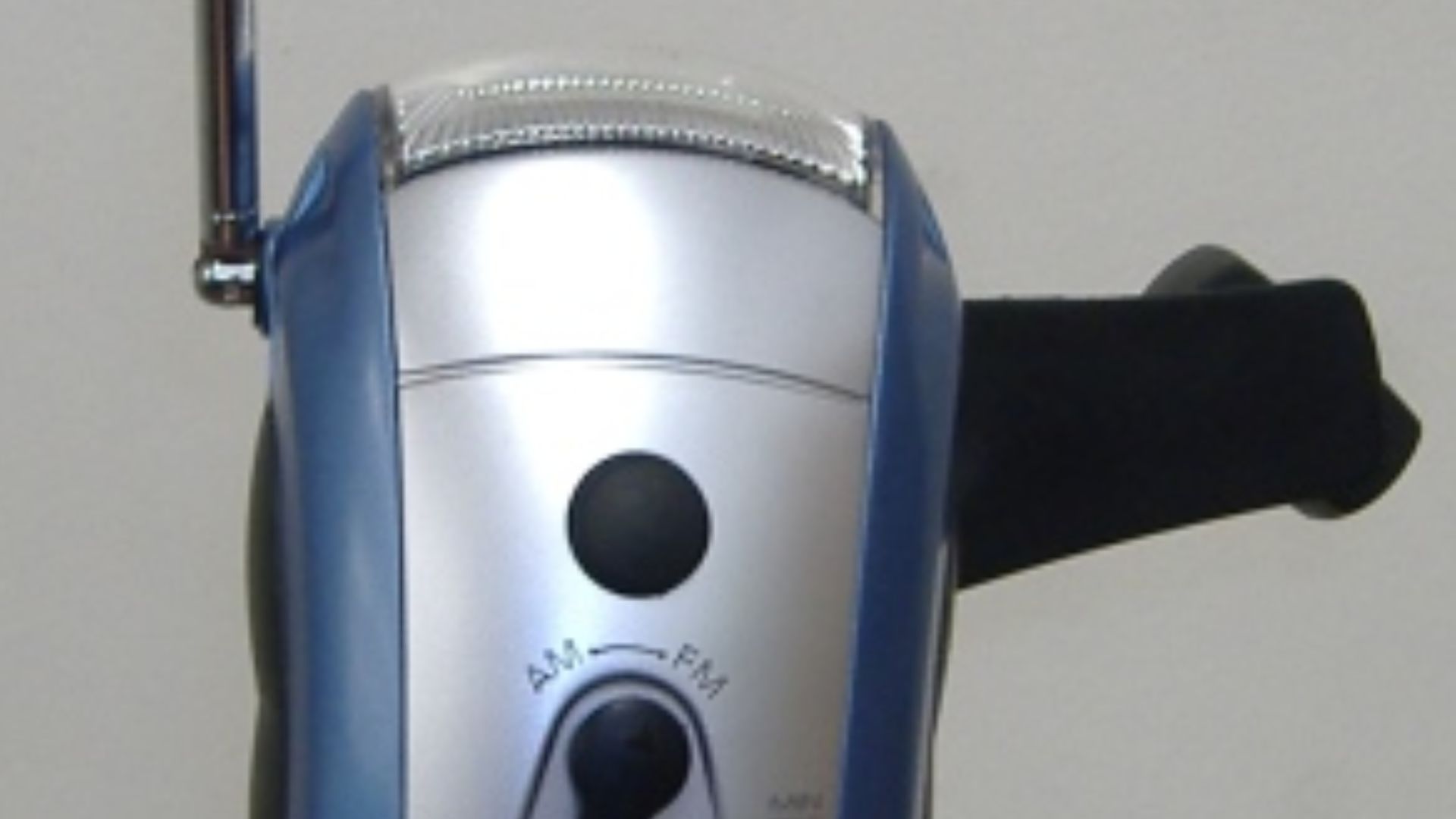 A mechanically-powered flashlight with built-in AM/FM radio.  The flashlight and radio run off an internal  rechargeable battery which is charged by turning the hand crank.