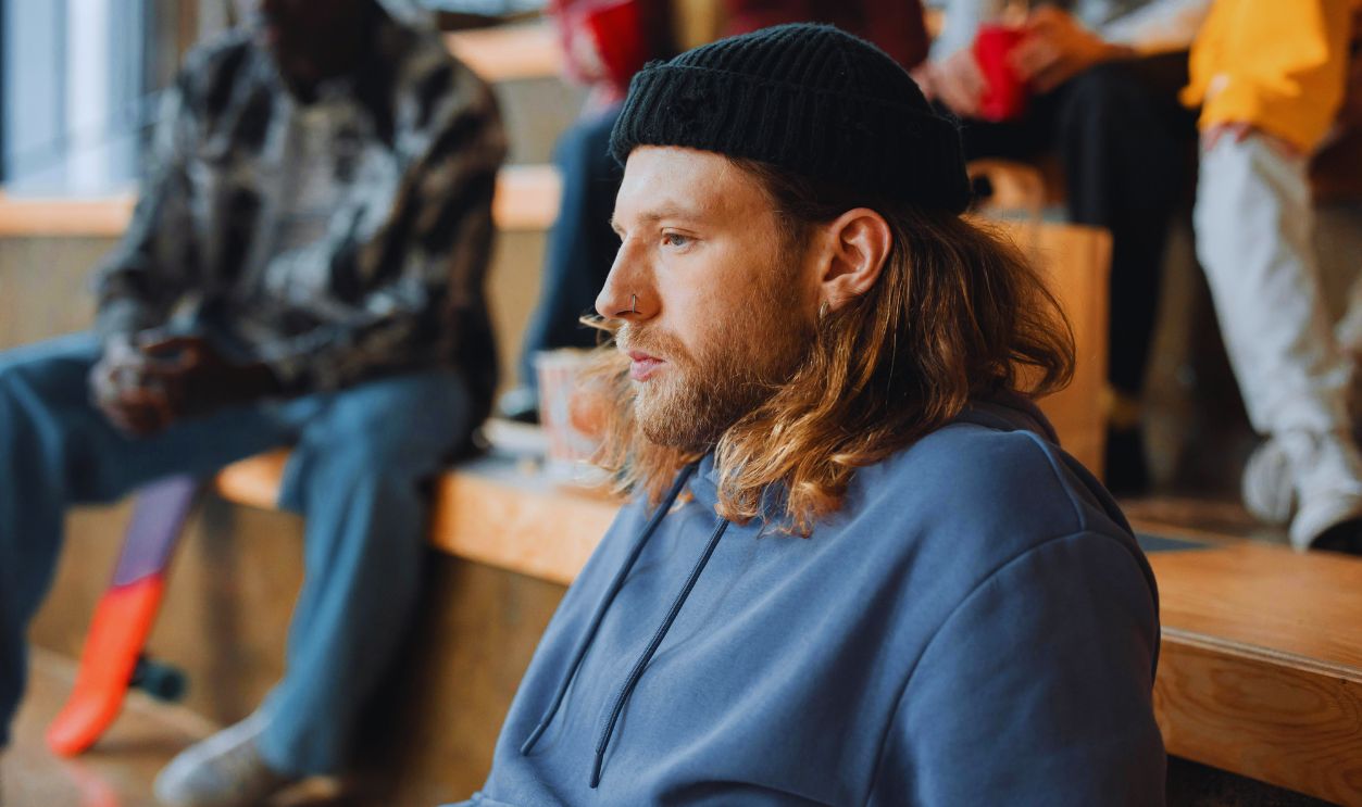 Side View of a Man with Facial Hair Wearing a Black Beanie