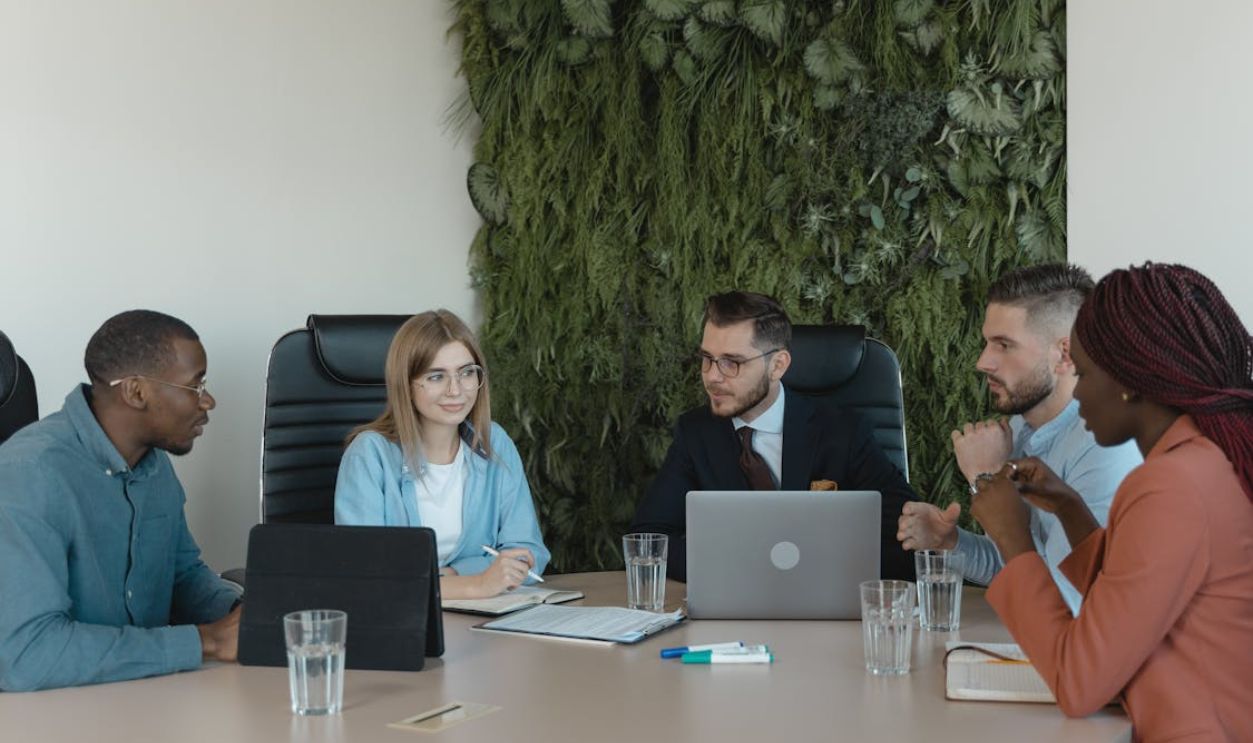 Employees Having a Conversation Inside the Office