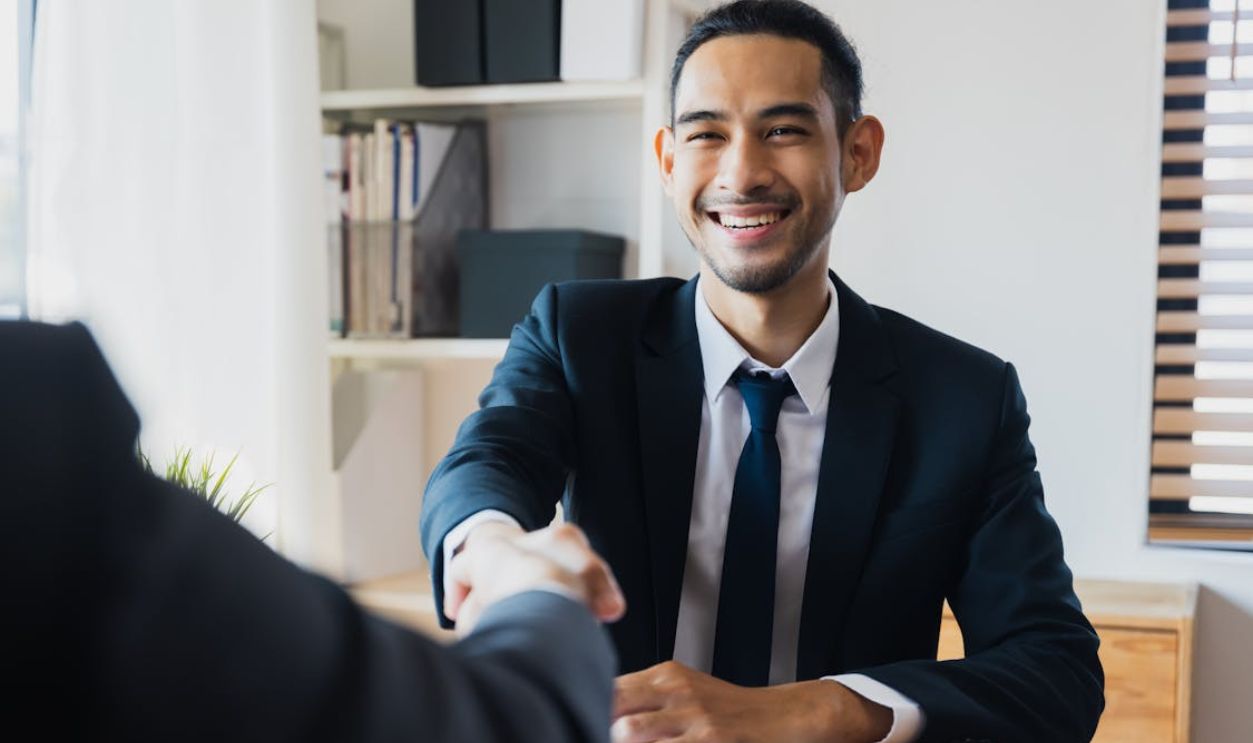 successful negotiate and handshake concept, two businessman shake hand with partner to celebration partnership and teamwork, business deal