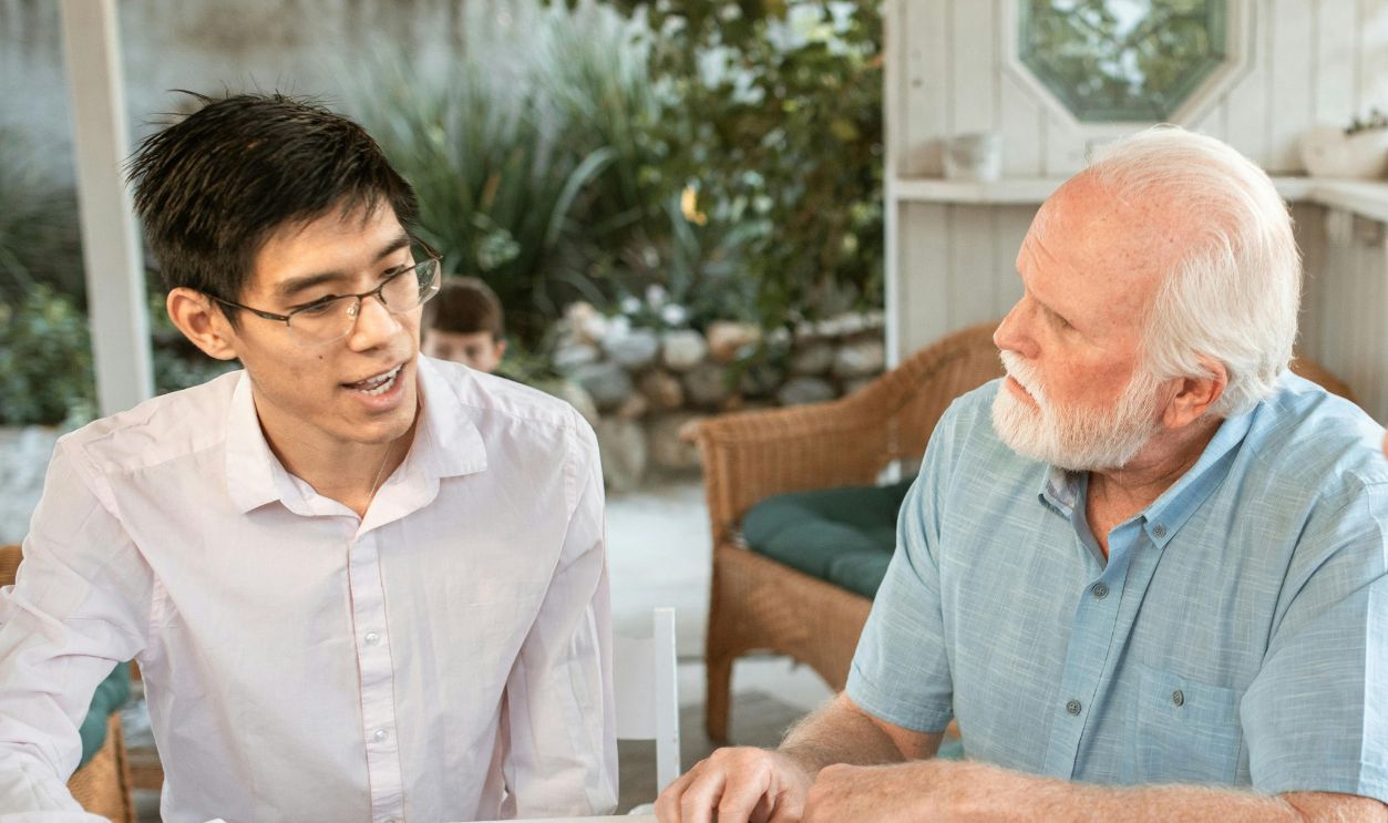 A Family Having a Conversation while Looking at the Sonogram on the Table