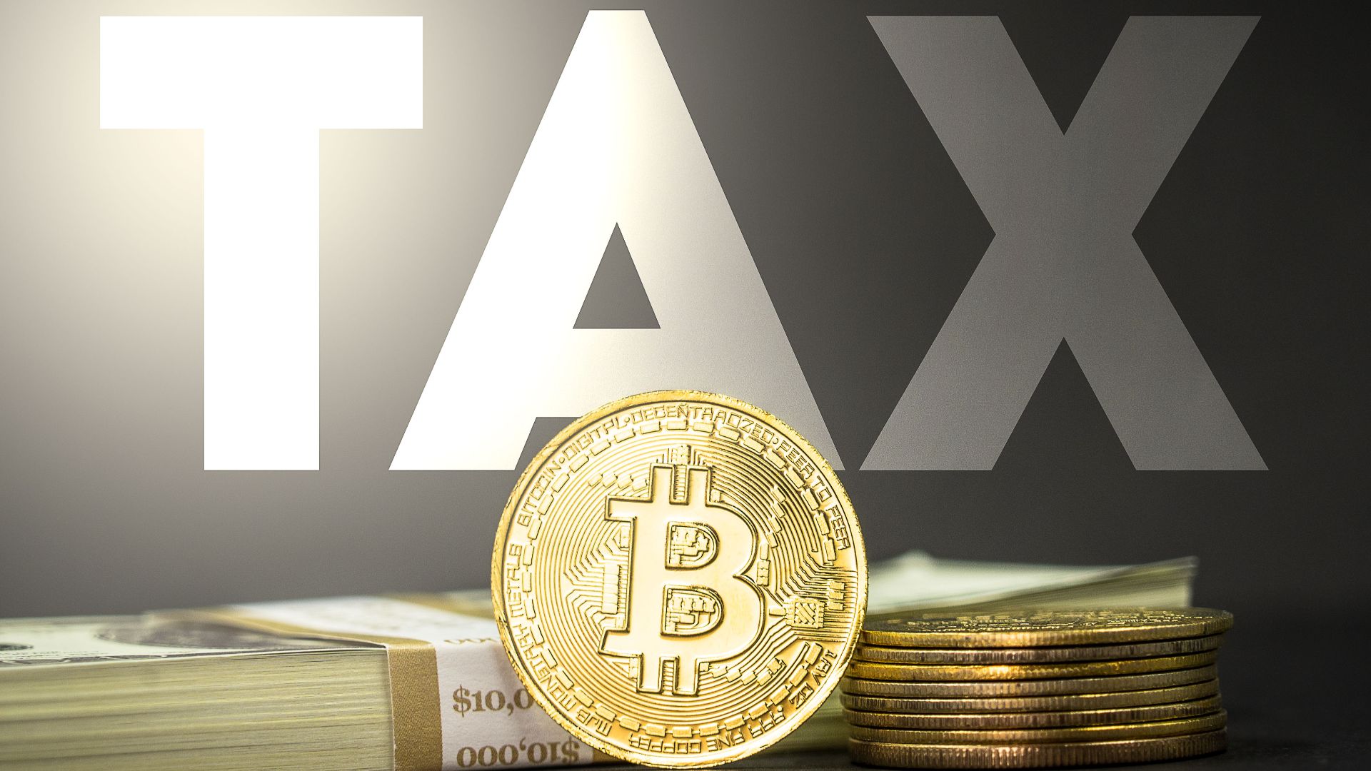 Cryptocurrency tax concept image featuring a Bitcoin crypto medallion alongside some cash and the word 'tax' in large lettering. You can use this image under the Attribution Creative Commons licensing as long as you credit www.bybit.com with a website link.