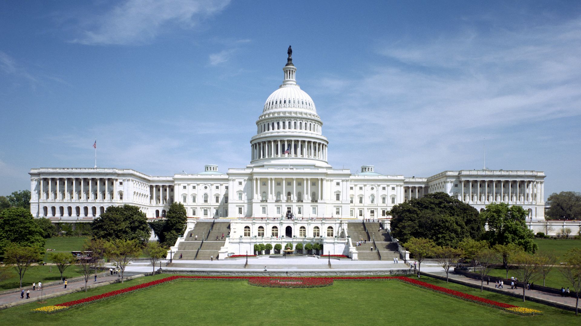 The western front of the United States Capitol. The Neoclassical style building is in Washington, D.C., on Capitol Hill, at the east end of the National Mall. The Capitol was designated a National Historic Landmark in 1960.