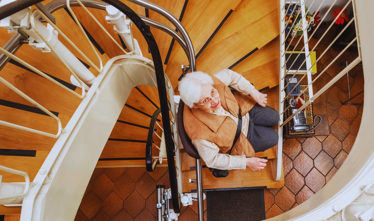 Elderly Woman in the Staircase Using the Stairlift