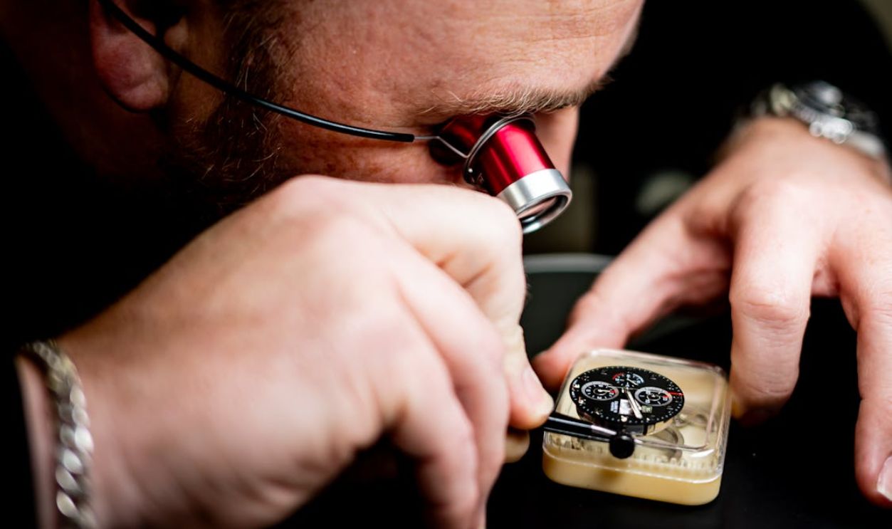 Watchmaker Inspecting a Detailed Timepiece