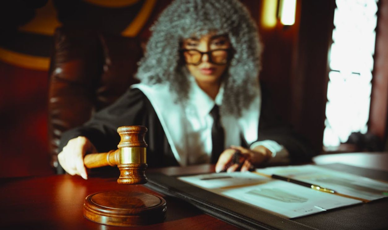 Judge in Courtroom with Gavel and Documents