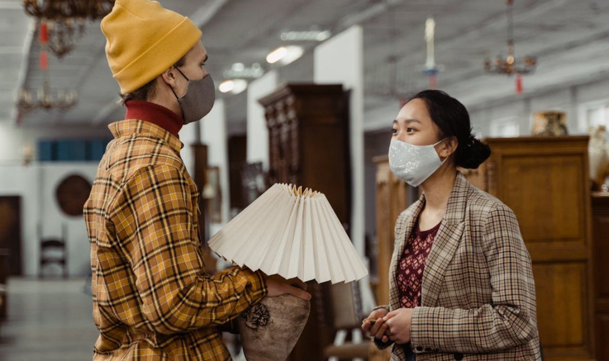 A Man and a Woman Inside an Antique Store