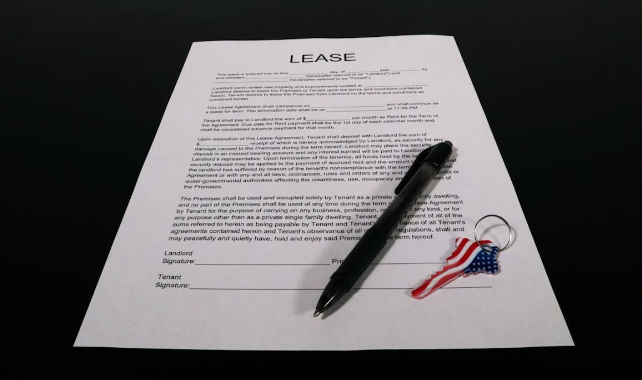 Lease Agreement Document with Pen and Keychain