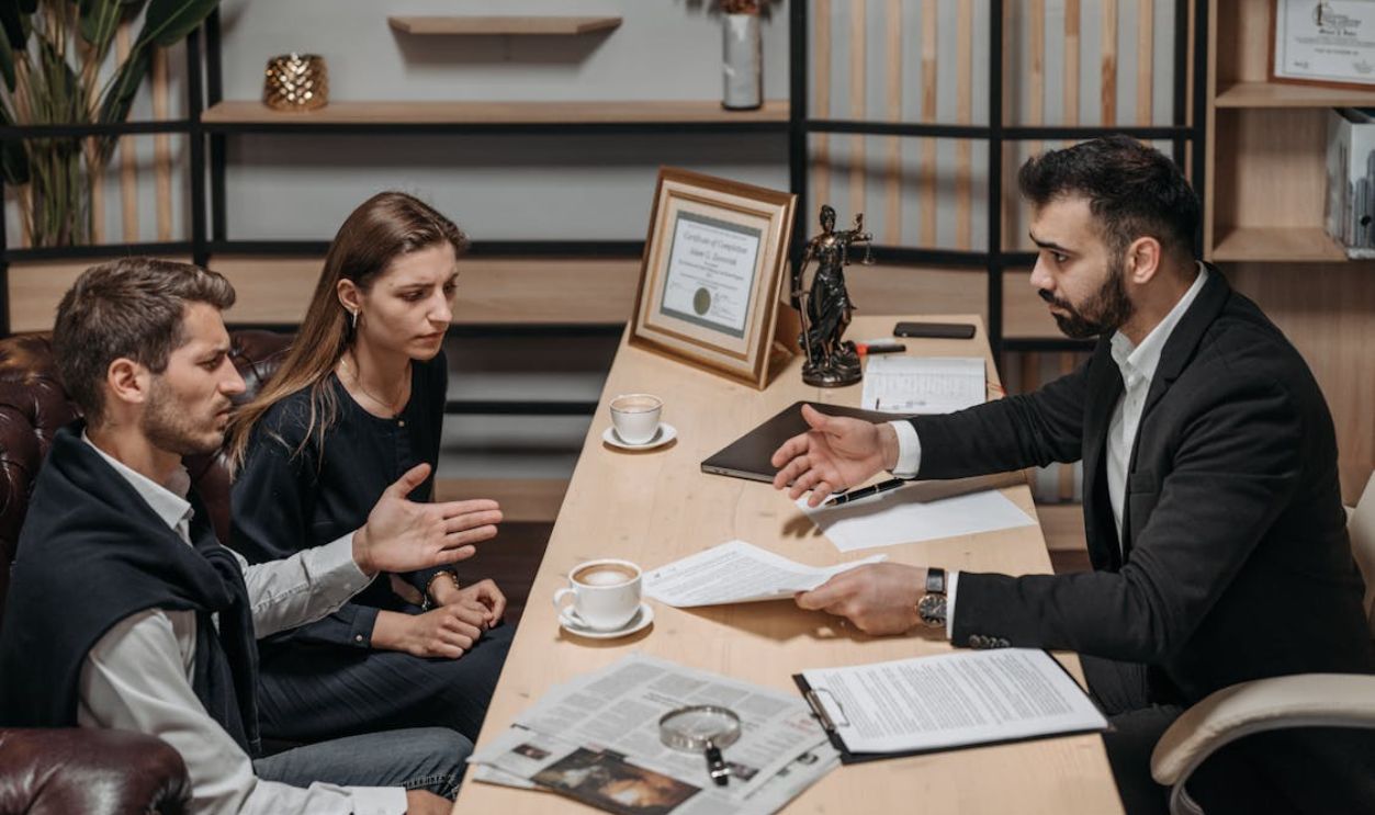 Male Lawyer talking to his Clients