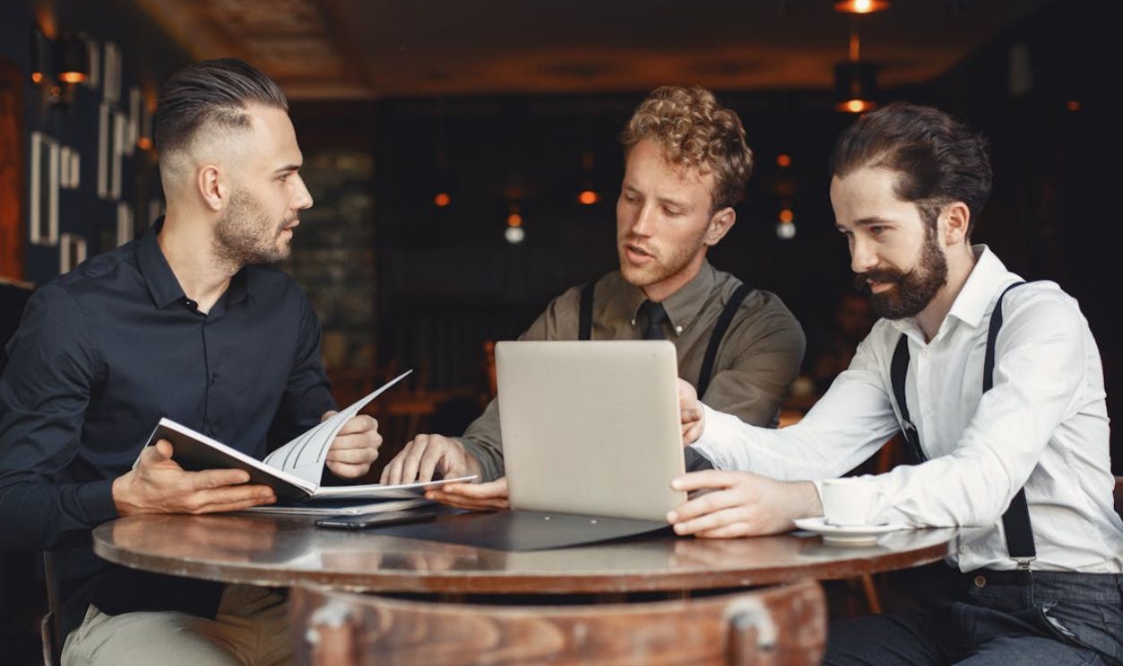 People Working by Table