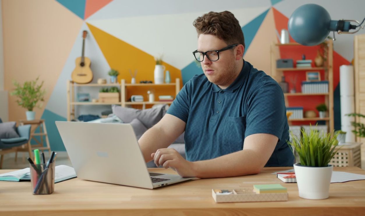 Man working on a laptop at a desk