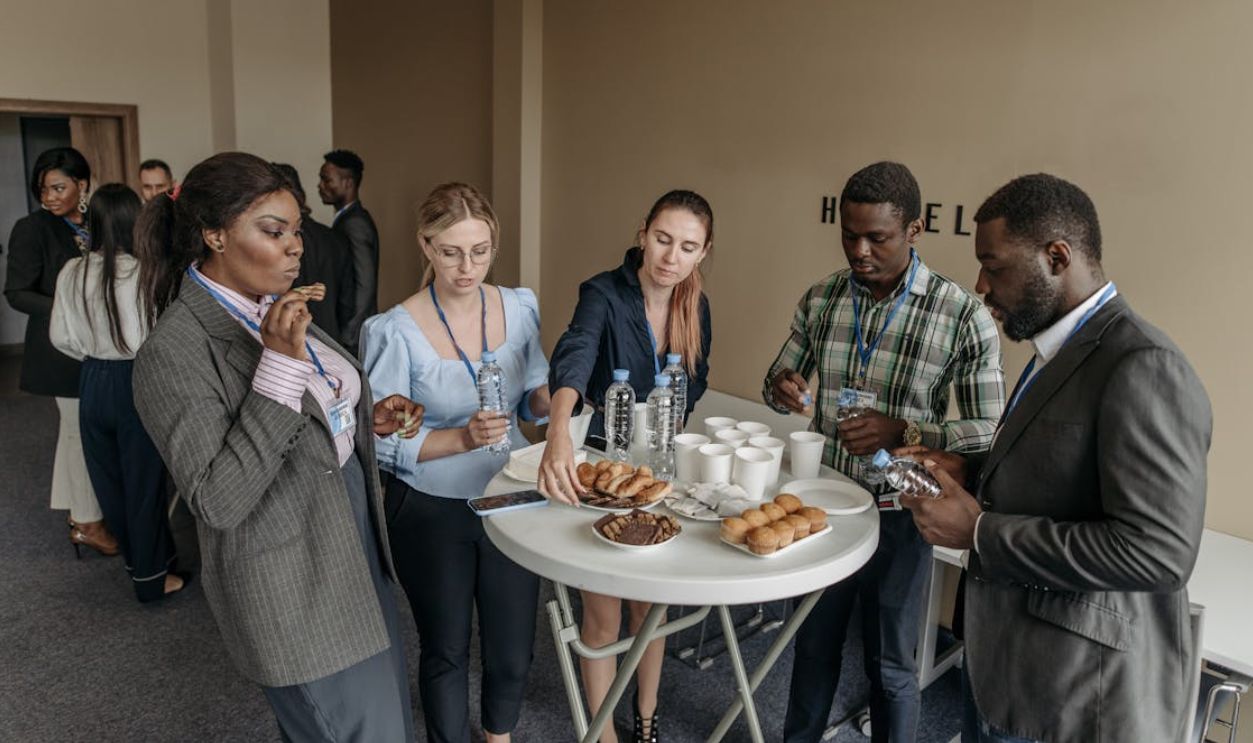 People Eating while Standing at the Table