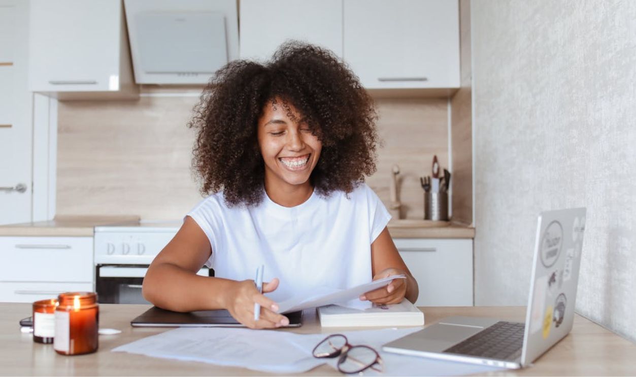 A Happy Woman Holding a Document
