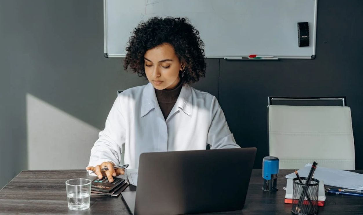 Woman Sitting with Laptop