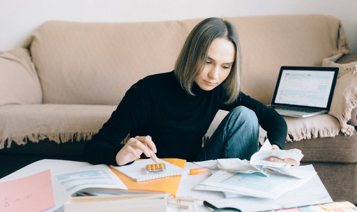 Woman in Black Long Sleeves Shirt Doing Accounting
