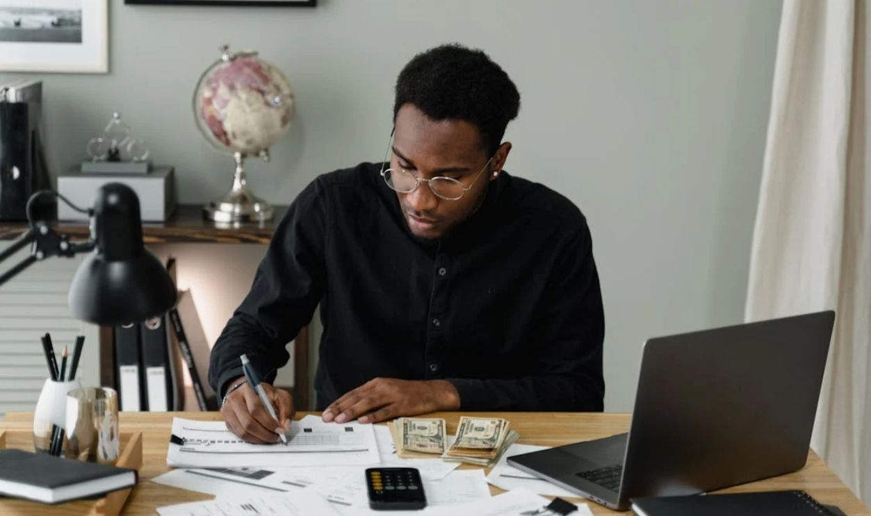 A Man Writing on the Paper