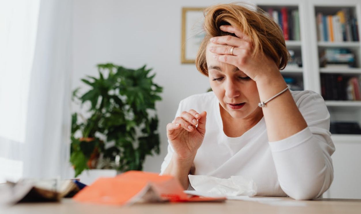 Woman with Hand on Forehead