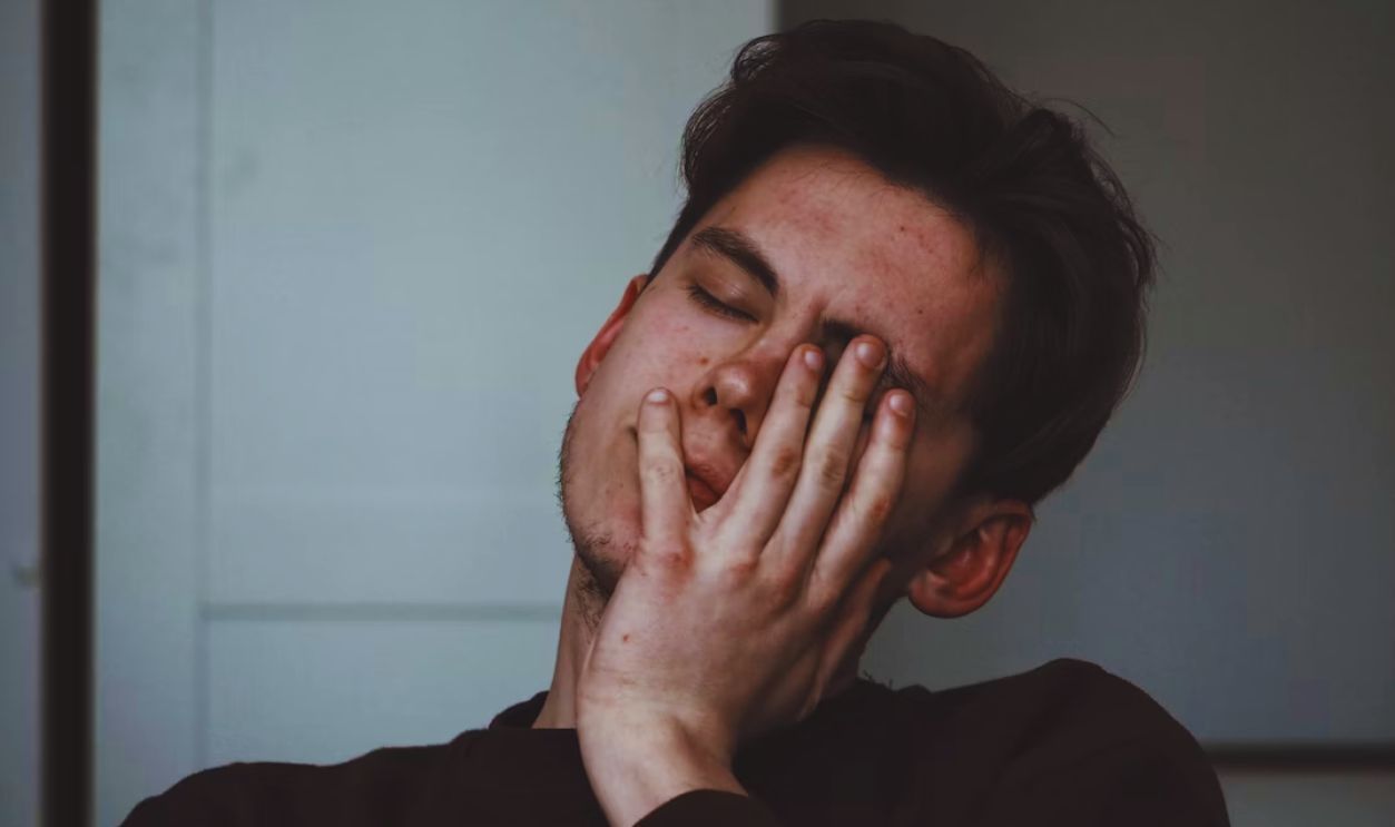 man wearing black crew-neck top