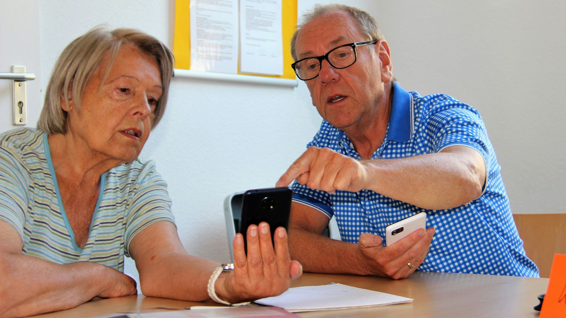 a man and a woman sitting at a table