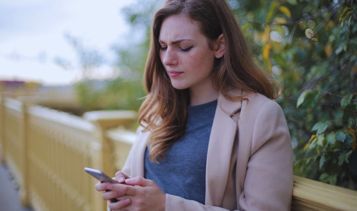Pensive Woman in Using Smartphone