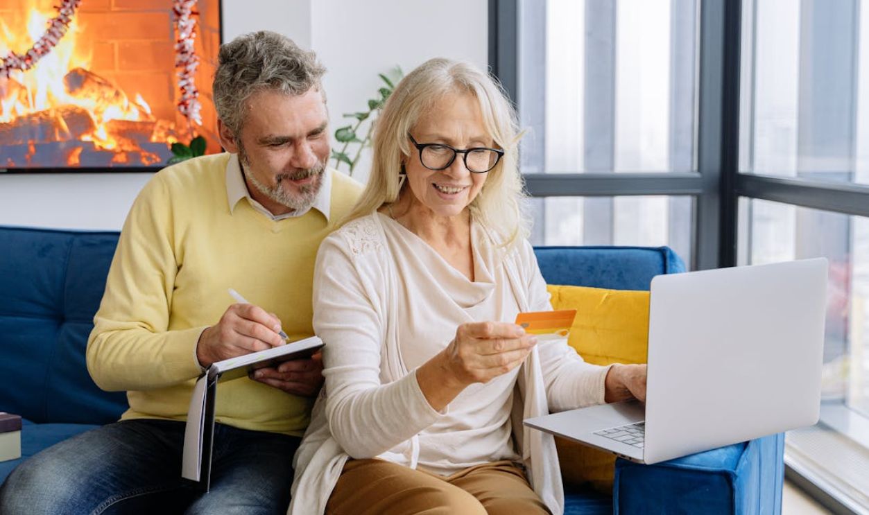 An Elderly Couple Looking at a Bank Card