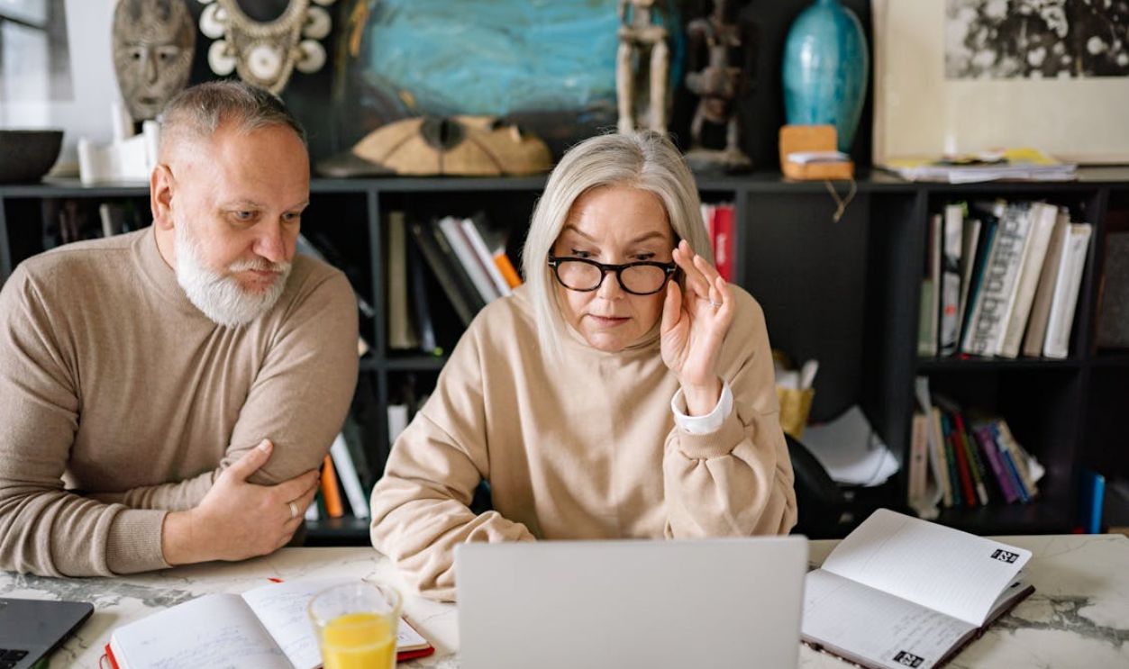 Elderly People Looking at the Monitor of a Laptop