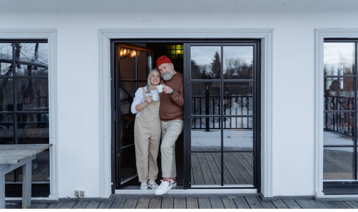 Man and Woman Standing by the Door