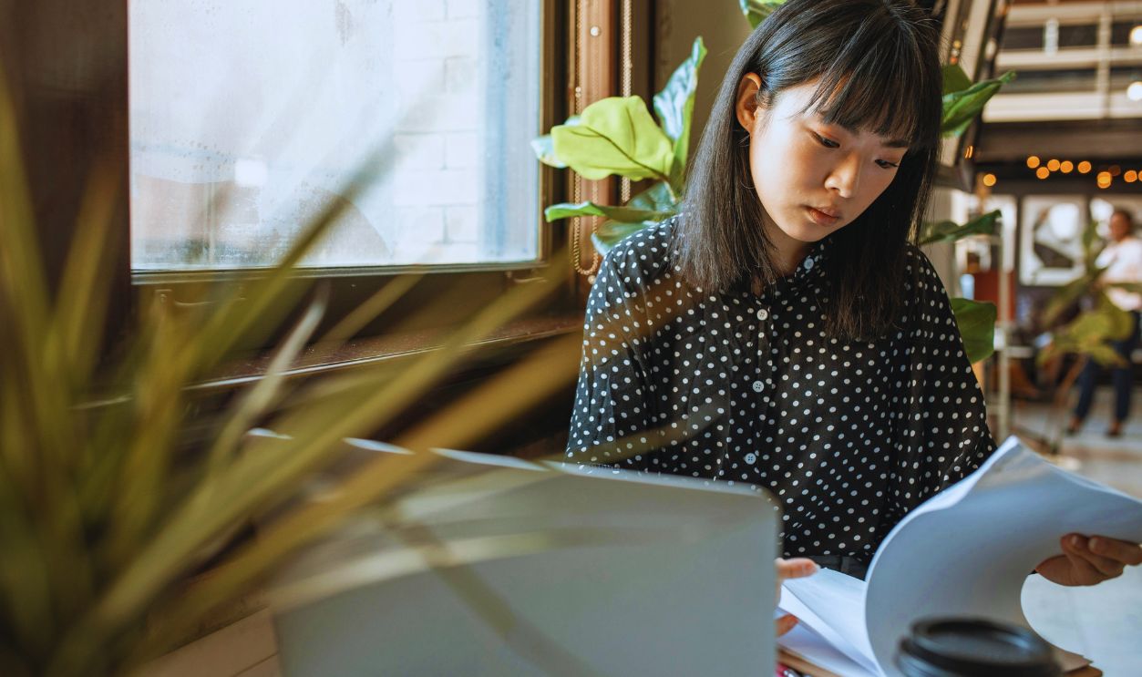 A Woman Reading Documents