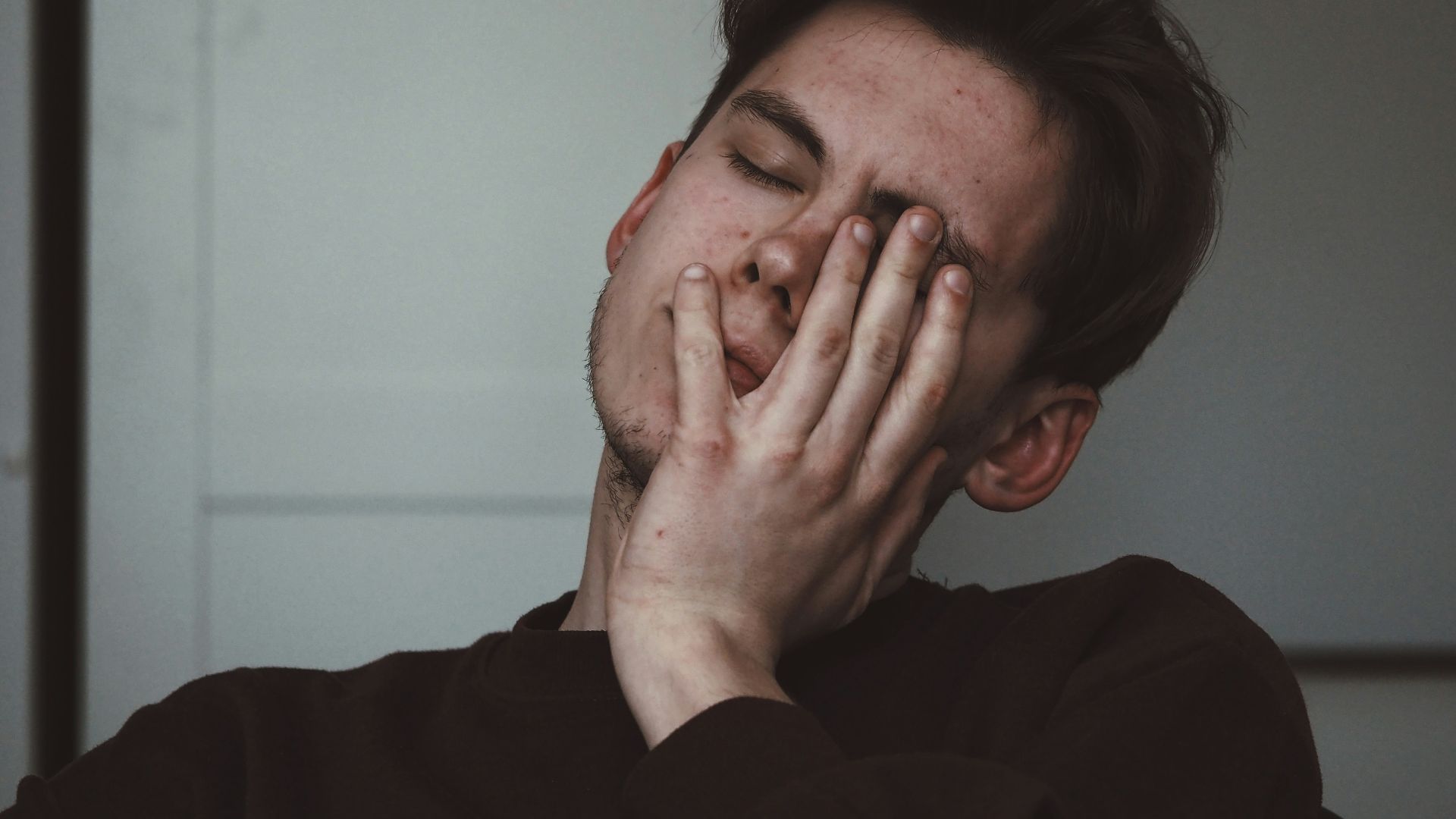 man wearing black crew-neck top